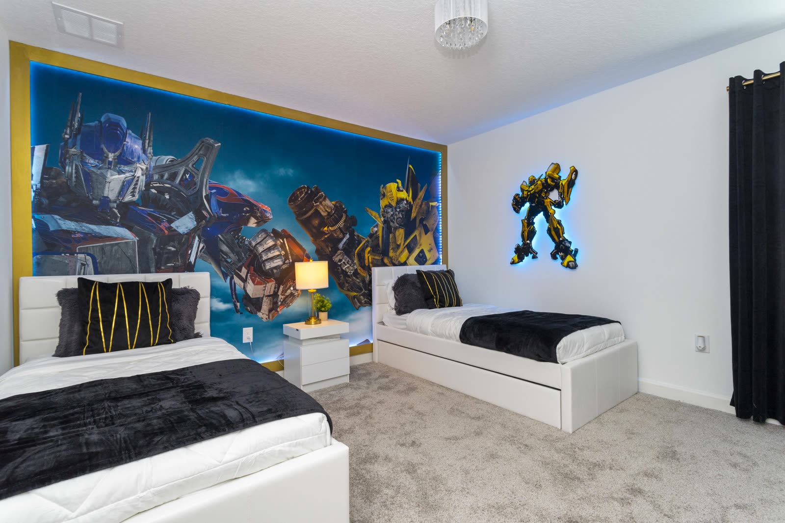 Transformers themed bedroom with Optimus Prime and Bumblebee mural at The Disney Villa