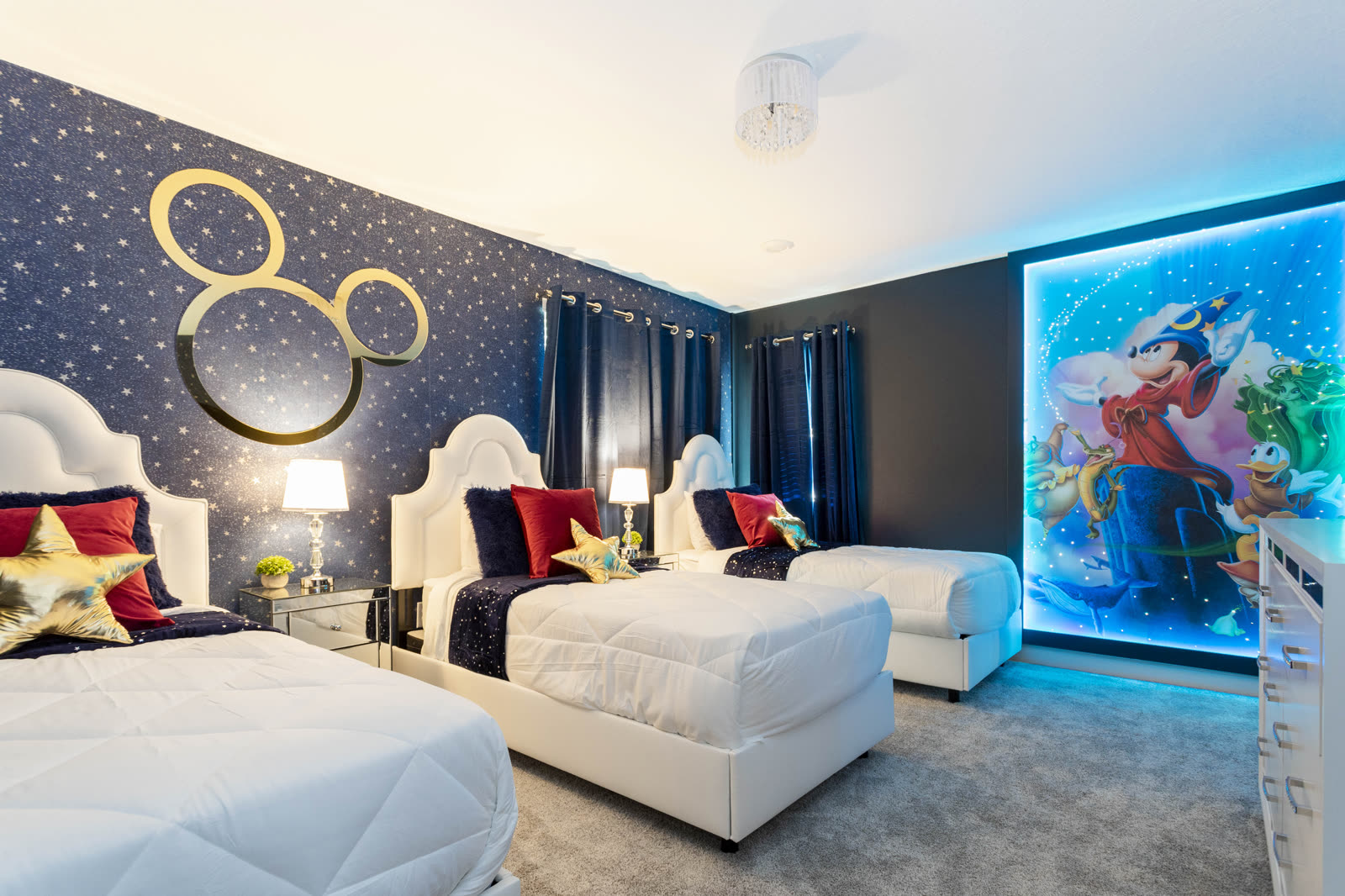 Mickey themed bedroom with gold Mickey wall and Fantasia mural